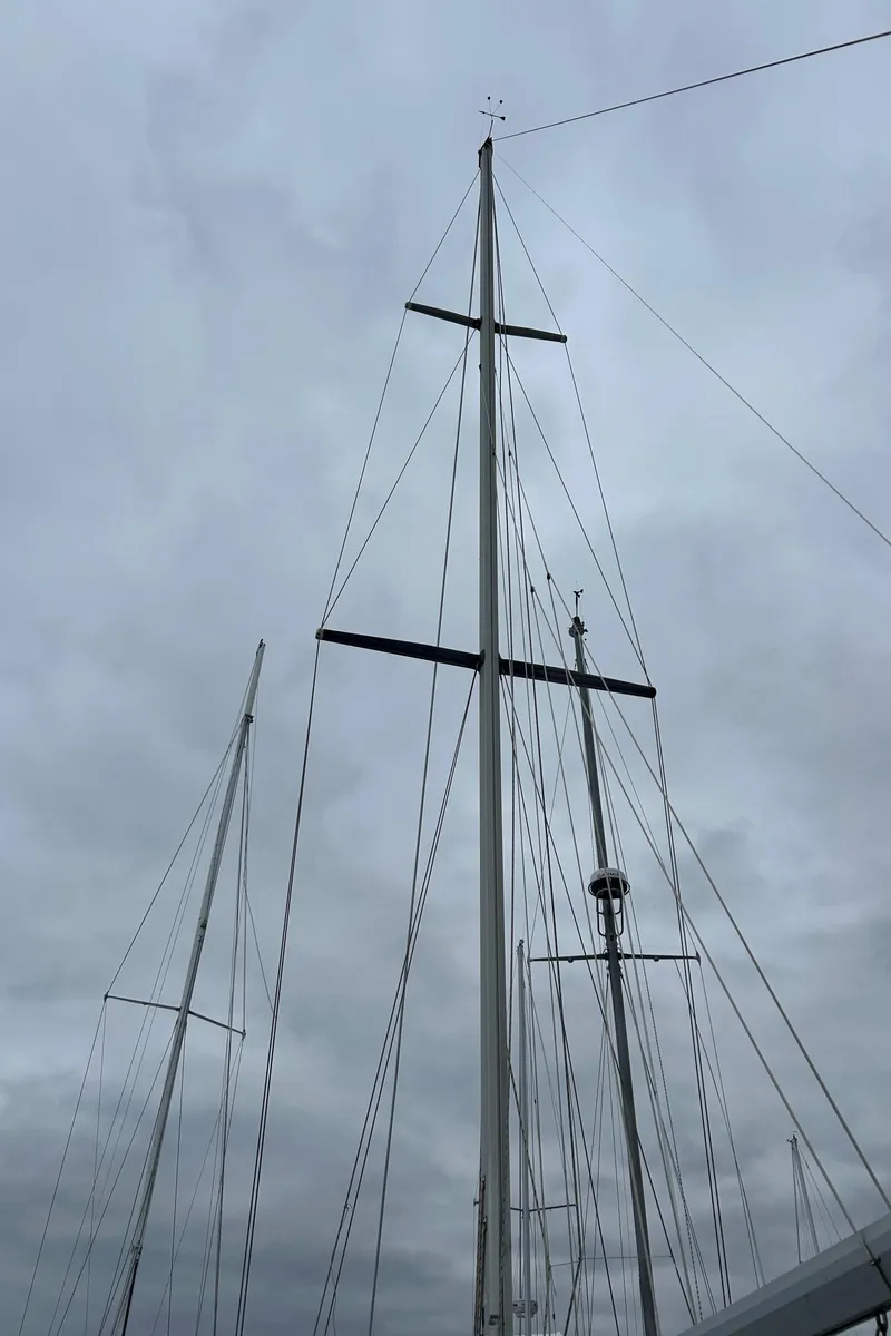 Slide: The Image of 1983 O'Day 39 sailboat mast against cloudy sky. - 3