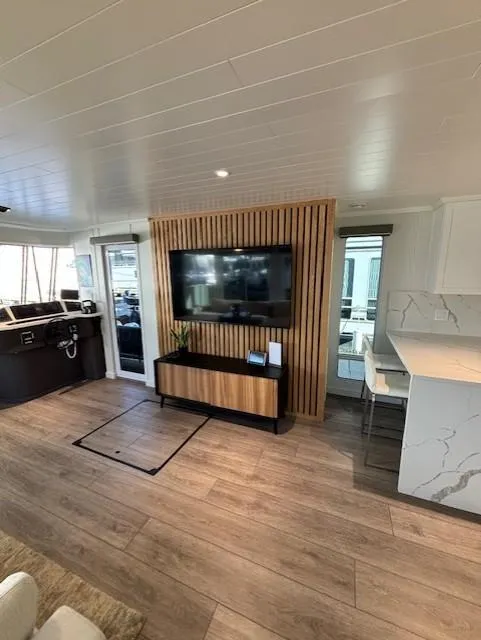 Slide: The Image of Modern interior of 1999 Horizon Stoke Houseboat with wood paneling and sleek design elements. - 13