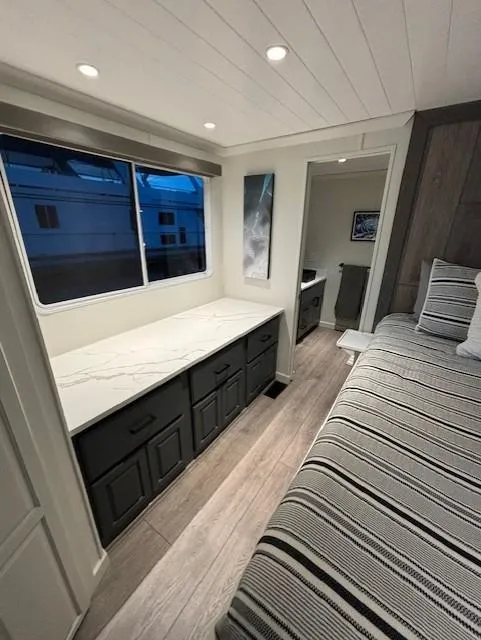 Slide: The Image of Modern interior of 1999 Horizon Stoke House with striped bedding and sleek cabinetry. - 31