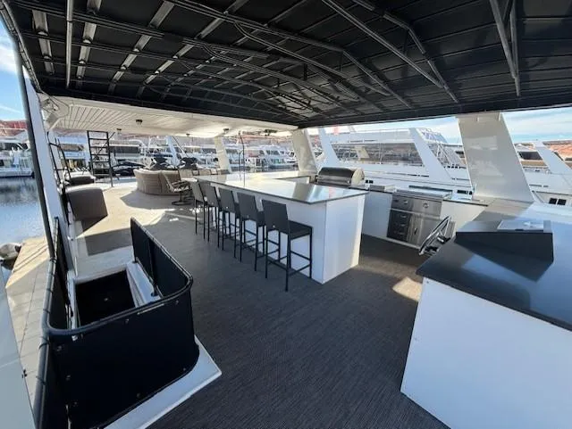 Slide: The Image of Spacious deck of 1999 Horizon Stoke House with bar seating and modern amenities. - 36