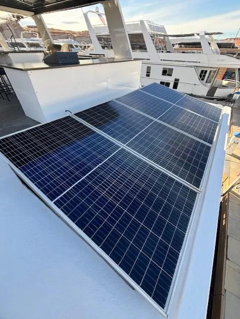 Slide: The Image of Solar panels on 1999 Horizon Stoke House boat, docked in marina. - 43