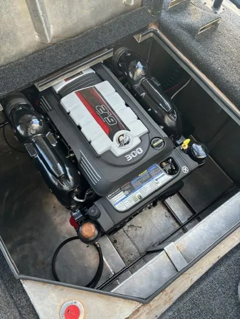 Slide: The Image of Engine compartment of a 1999 Horizon Stoke House 1/2 share boat, featuring a 300 horsepower engine. - 47