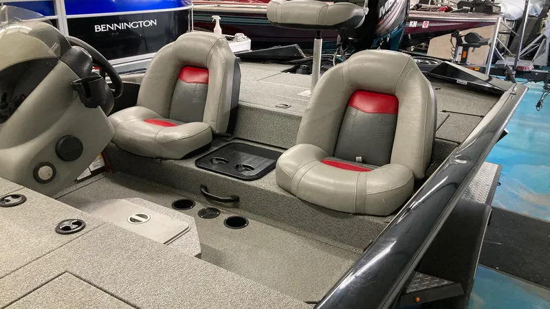 Slide: The Image of 2017 Bass Tracker PRO TEAM 190 TX interior with gray and red seating. - 10