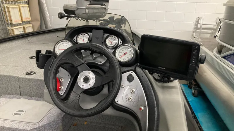 Slide: The Image of 2017 Bass Tracker PRO TEAM 190 TX dashboard with steering wheel and gauges. - 11
