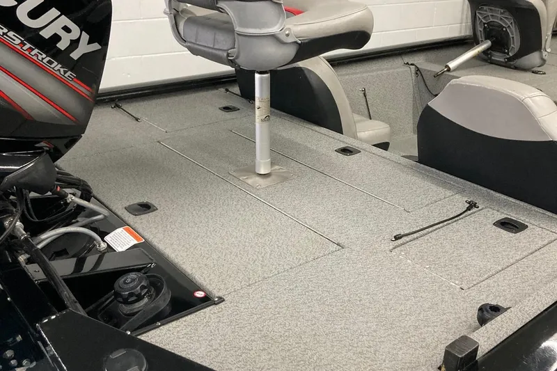 Slide: The Image of 2017 Bass Tracker PRO TEAM 190 TX boat interior with seating and storage compartments. - 12