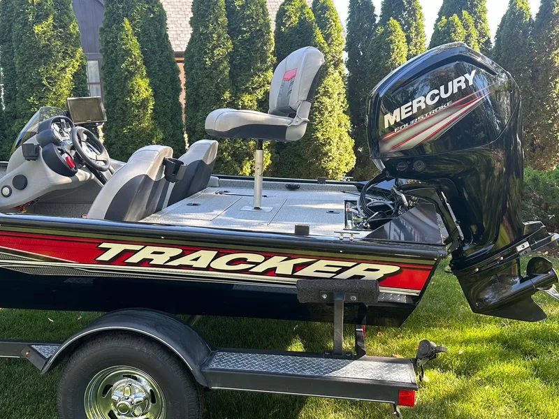 Slide: The Image of 2017 Bass Tracker PRO TEAM 190 TX boat with Mercury engine on trailer. - 2