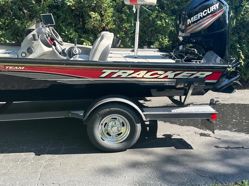 Slide: The Image of 2017 Bass Tracker PRO TEAM 190 TX boat with Mercury engine on a trailer. - 3