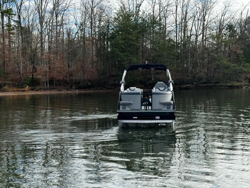 Slide: The Image of 2025 Montara Surf Boss 2.0 25 on a serene lake with forest backdrop. - 7
