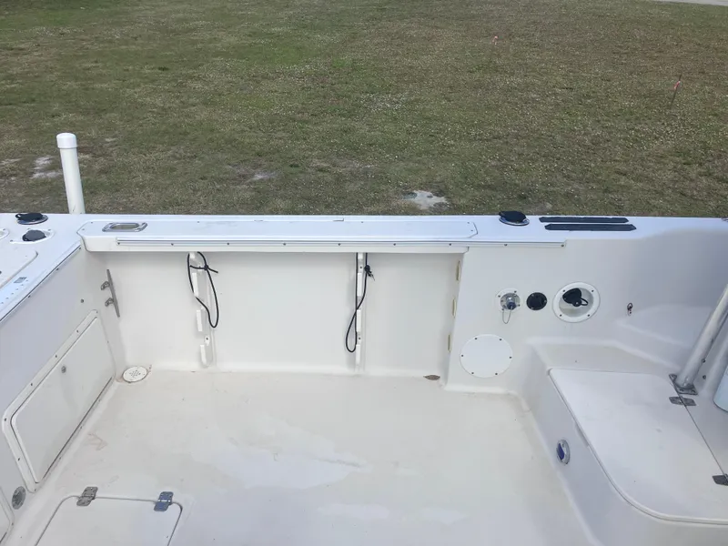 Slide: The Image of 1998 Pro-Line 241 Walkaround boat deck, spacious and clean, ready for fishing or leisure. - 13