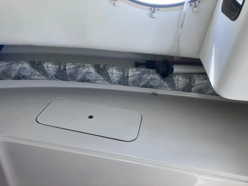 Slide: The Image of 1998 Pro-Line 241 Walkaround interior detail with storage compartment and window. - 21