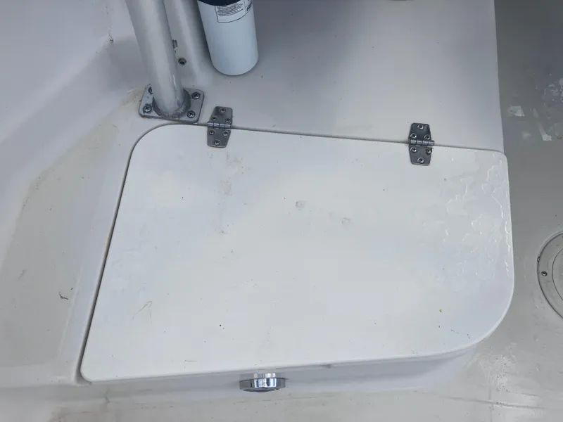 Slide: The Image of 1998 Pro-Line 241 Walkaround boat hatch with hinges and latch. - 31