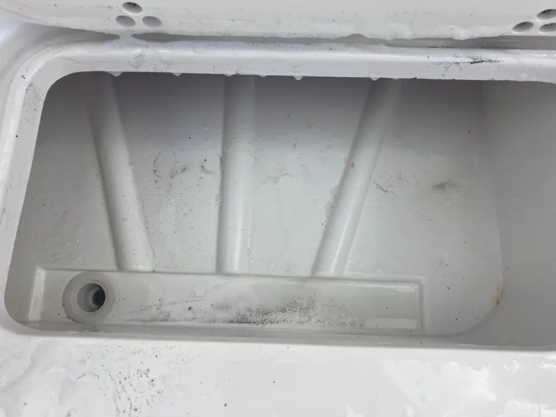 Slide: The Image of Empty storage compartment in a 1998 Pro-Line 241 Walkaround boat. - 32