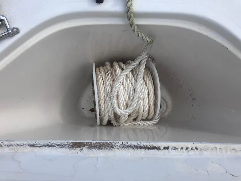 Slide: The Image of Coiled rope in a compartment of a 1998 Pro-Line 241 Walkaround boat. - 37