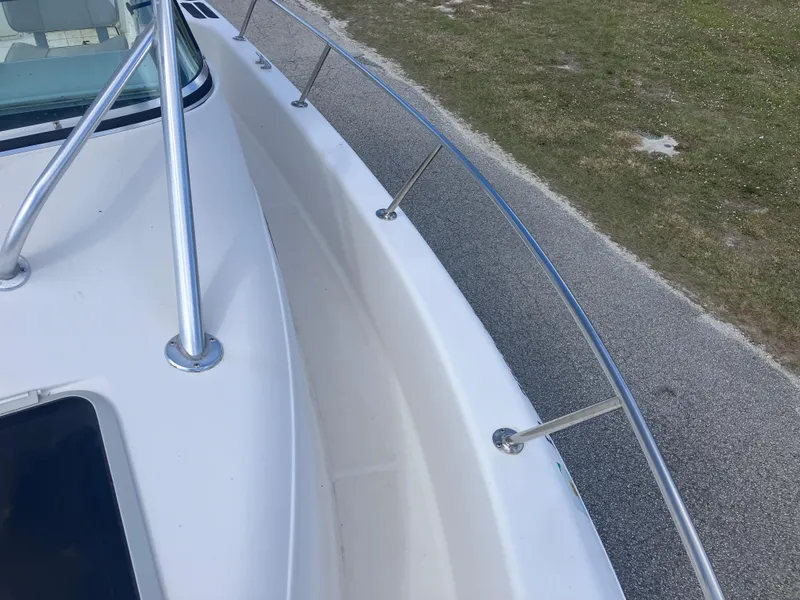 Slide: The Image of 1998 Pro-Line 241 Walkaround boat deck with stainless steel railings. - 40