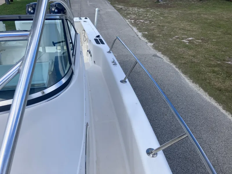 Slide: The Image of 1998 Pro-Line 241 Walkaround boat deck with stainless steel railings. - 41