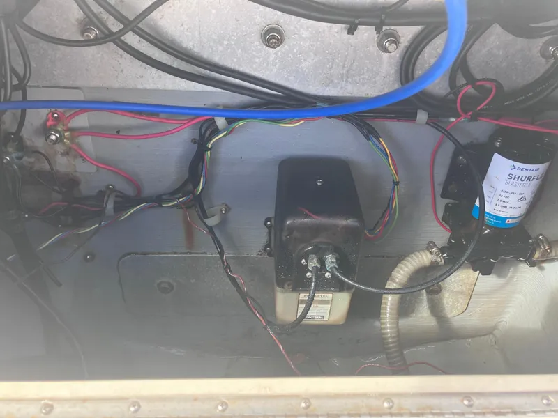 Slide: The Image of Electrical wiring and components inside a 1998 Pro-Line 241 Walkaround boat. - 46