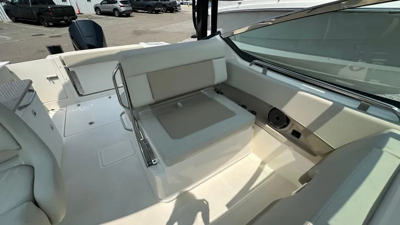 Slide: The Image of 2025 Boston Whaler 240 Vantage interior with seating and storage features. - 17