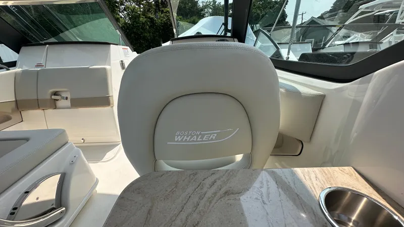 Slide: The Image of 2025 Boston Whaler 240 Vantage interior with luxurious seating and sleek design. - 23