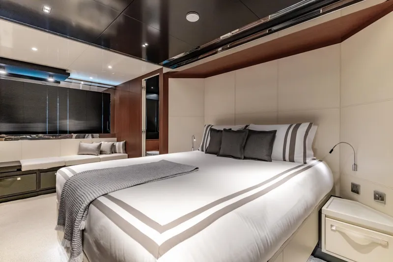 Slide: The Image of Luxurious bedroom interior on 2019 Riva ARGO yacht with modern design and elegant bedding. - 11