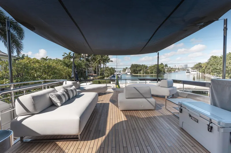 Slide: The Image of Luxurious 2019 Riva ARGO yacht deck with modern seating and scenic waterfront view. - 19