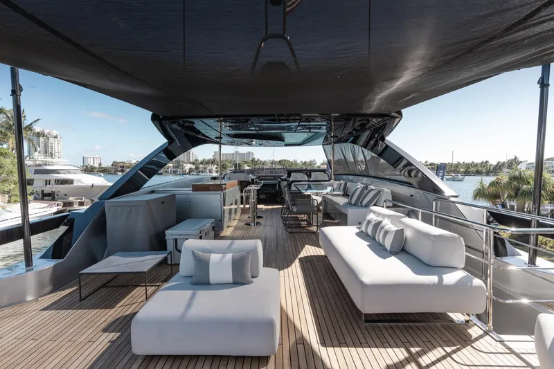 Slide: The Image of Luxurious 2019 Riva ARGO yacht deck with modern seating and scenic waterfront view. - 18