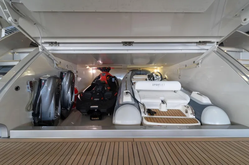 Slide: The Image of Storage compartment of 2019 Riva ARGO yacht with jet skis and inflatable boat. - 25