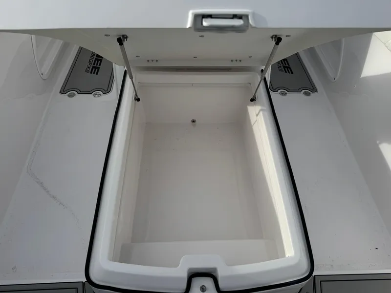 Slide: The Image of Open storage compartment on 2025 Twin Vee 280 GFX2 CC boat. - 11