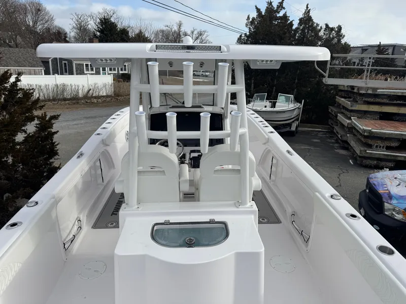 Slide: The Image of 2025 Twin Vee 280 GFX2 CC boat, white interior, docked outdoors. - 3