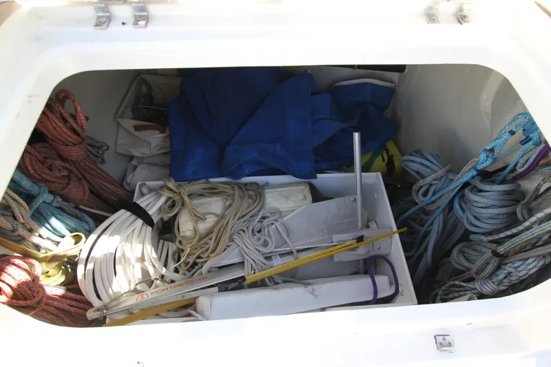 Slide: The Image of Storage compartment on a 2006 Nautor Swan 46mkIII sailboat, filled with ropes and equipment. - 29