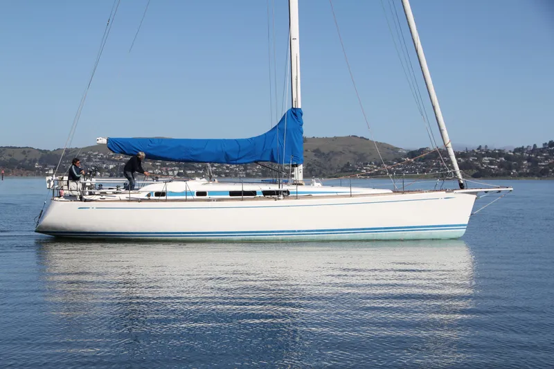 Slide: The Image of Sailing yacht Nautor Swan 46mkIII, 2006 model, on calm water with blue cover. - 3