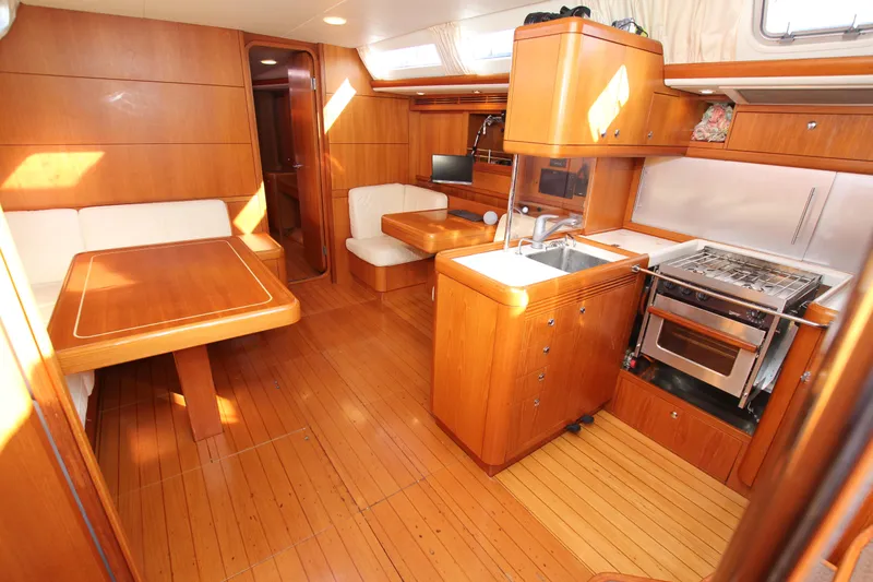 Slide: The Image of Luxurious interior of 2006 Nautor Swan 46mkIII yacht with wood finish and modern amenities. - 40