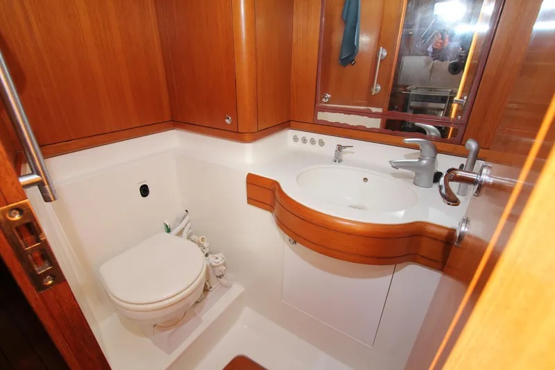 Slide: The Image of Luxurious wooden bathroom in 2006 Nautor Swan 46mkIII yacht with modern fixtures. - 47