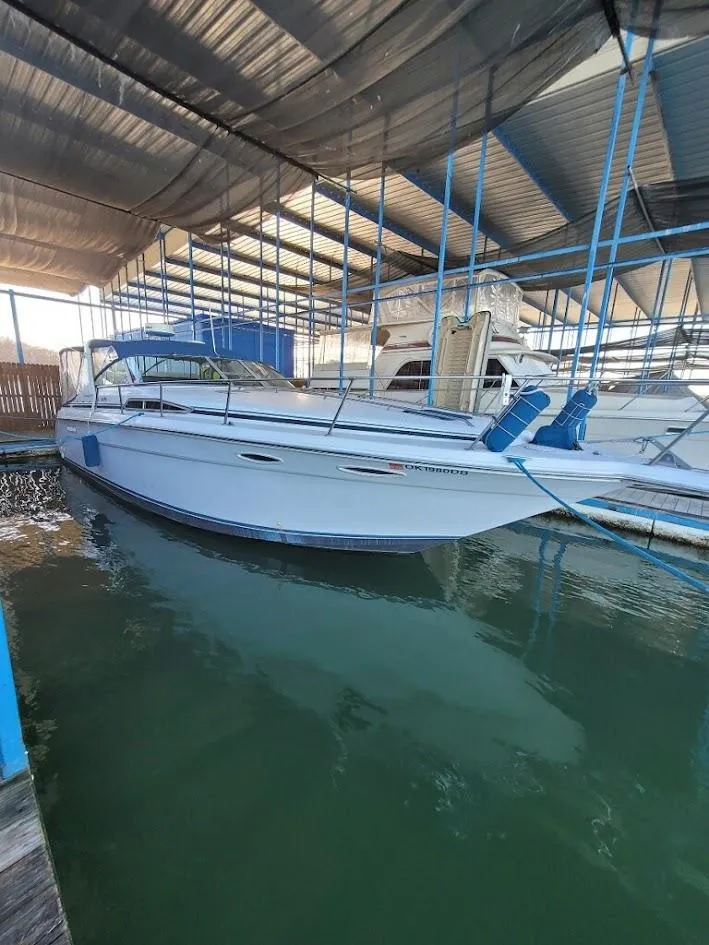 The Image of 1991 Sea Ray 350 Express Cruiser docked in marina. - 0