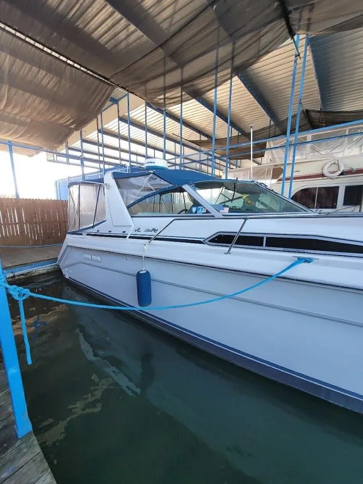 Slide: The Image of 1991 Sea Ray 350 Express Cruiser docked in marina. - 3