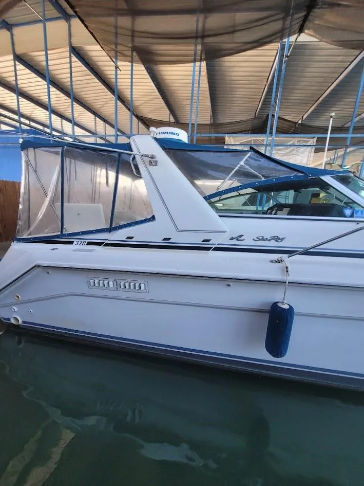 Slide: The Image of 1991 Sea Ray 350 Express Cruiser docked in marina. - 4