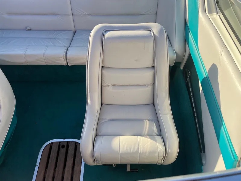 Slide: The Image of White leather seat in 1992 Celebrity 180 Bowrider boat interior. - 14