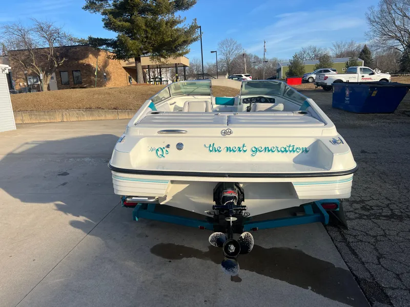 Slide: The Image of 1992 Celebrity 180 Bowrider boat, "The Next Generation," parked outdoors on a sunny day. - 6