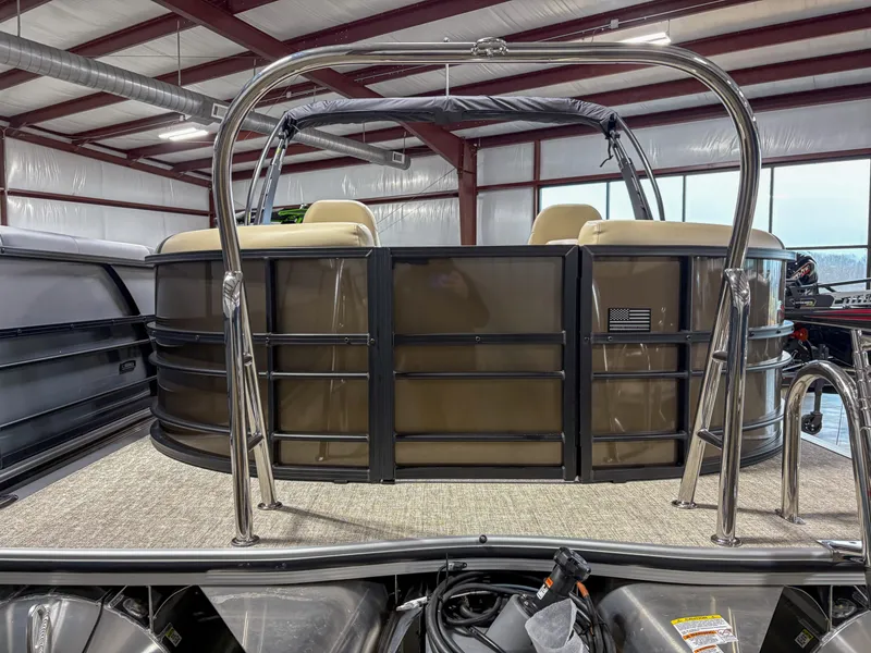 Slide: The Image of 2025 Trifecta 22 RF CS Arch pontoon boat in a warehouse setting. - 2