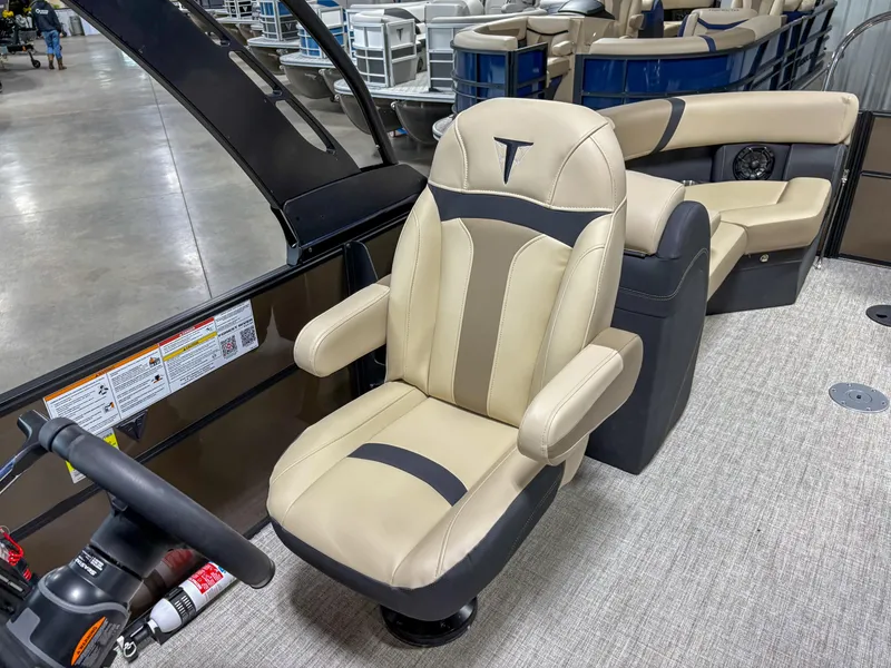 Slide: The Image of Luxurious seating in 2025 Trifecta 22 RF CS Arch boat, featuring beige and black upholstery. - 7