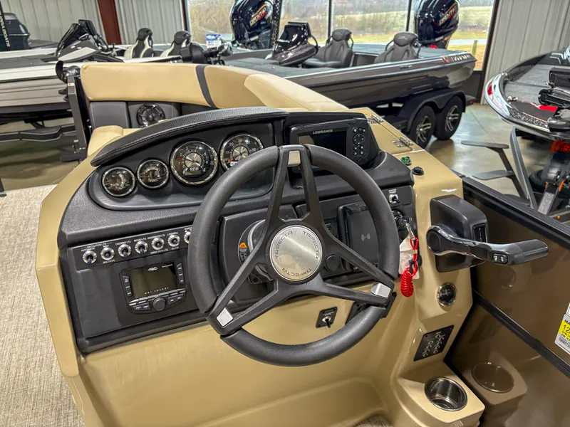 Slide: The Image of Steering console of 2025 Trifecta 22 RF CS Arch boat with gauges and controls. - 8