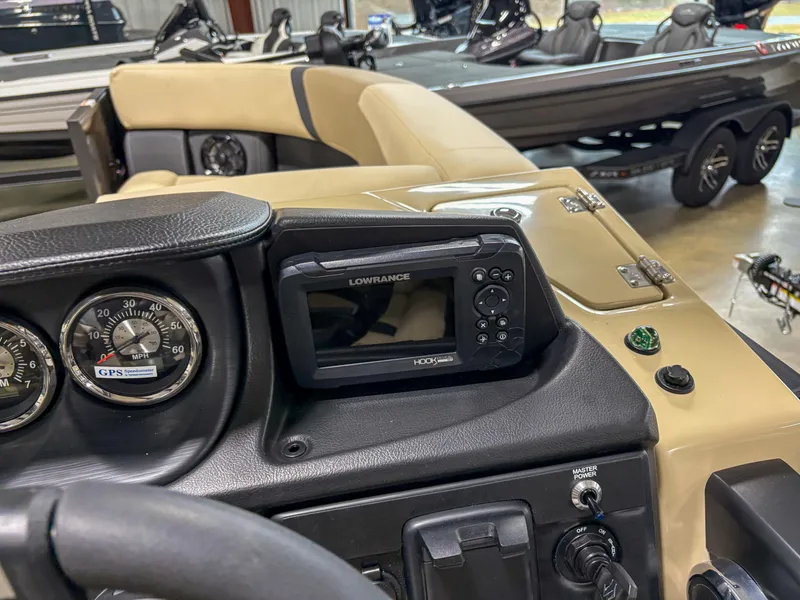 Slide: The Image of Dashboard of 2025 Trifecta 22 RF CS Arch boat with Lowrance GPS system. - 9