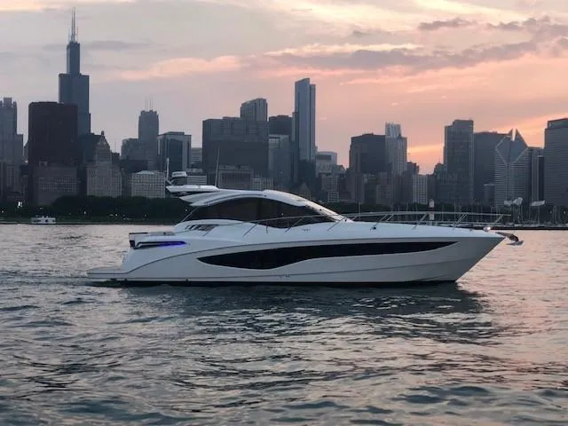 The Image of Galeon 485 yacht on water with city skyline at sunset, 2018 model. - 0