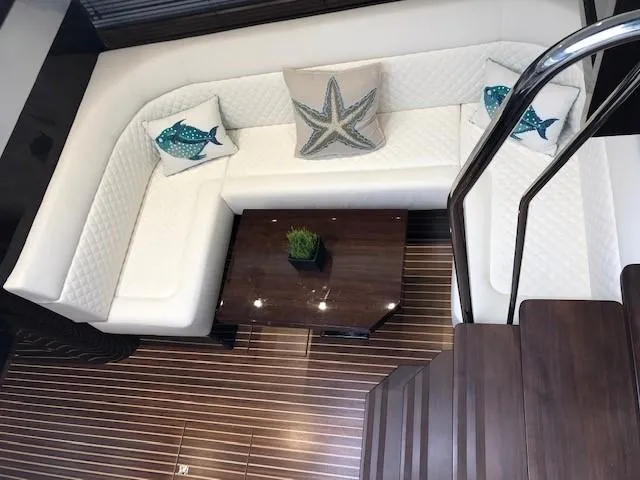 Slide: The Image of Luxurious interior of 2018 Galeon 485 yacht with white seating and decorative pillows. - 19