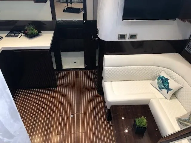 Slide: The Image of Luxurious interior of 2018 Galeon 485 yacht with white seating and elegant wood flooring. - 20