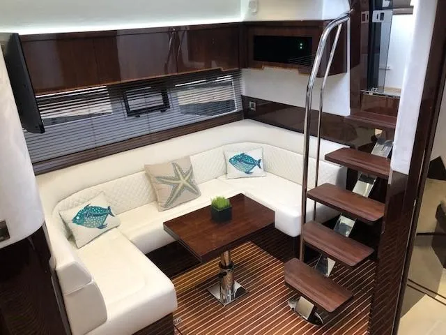 Slide: The Image of Luxurious interior of 2018 Galeon 485 yacht with elegant seating and wooden accents. - 22