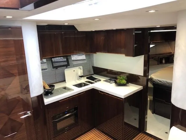 Slide: The Image of Luxurious kitchen interior of 2018 Galeon 485 yacht with modern amenities and sleek design. - 23