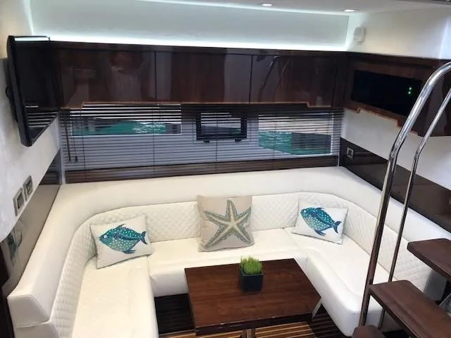 Slide: The Image of Luxurious interior of 2018 Galeon 485 yacht with white seating and decorative pillows. - 28