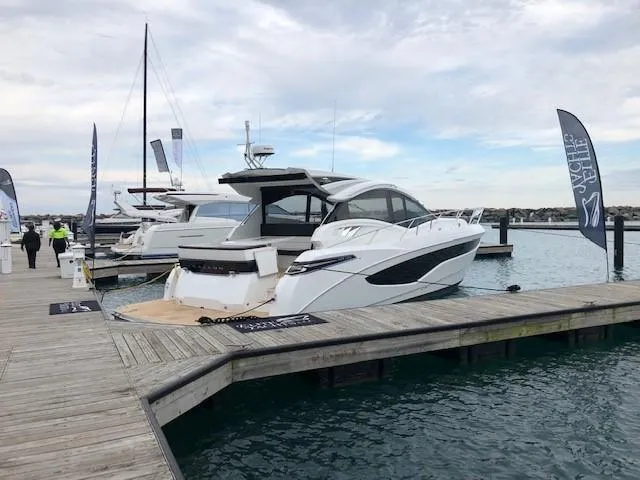 Slide: The Image of 2018 Galeon 485 yacht docked at marina with clear sky and calm water. - 3