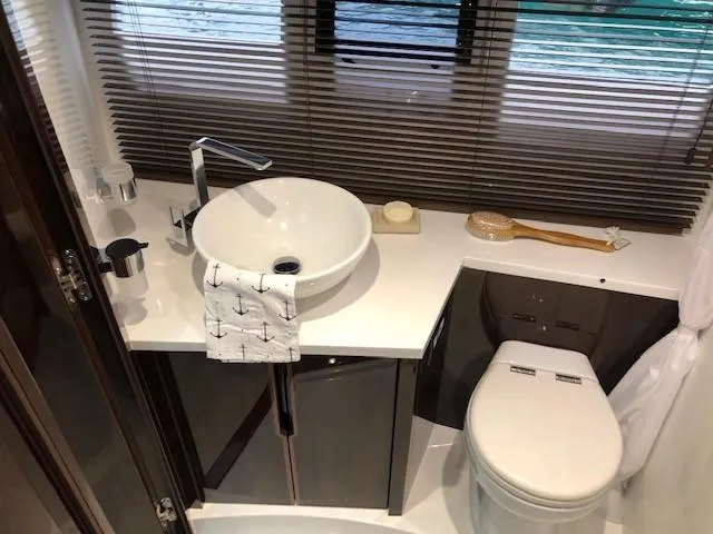 Slide: The Image of Luxurious bathroom in 2018 Galeon 485 yacht with modern sink and toilet. - 34