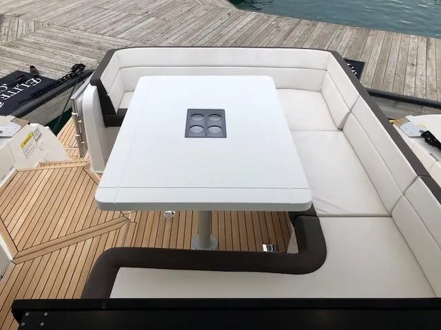 Slide: The Image of Luxury seating area on 2018 Galeon 485 yacht with elegant white cushions and table. - 9